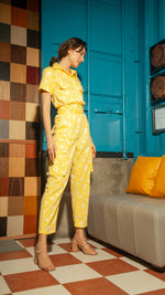 Load image into Gallery viewer, Short Sleeve Tapered Jumpsuit — Yellow Floral
