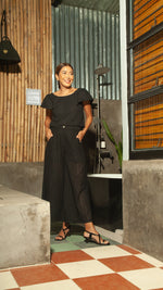 Load image into Gallery viewer, Flat Waistband Wide Hem Pants with Belt Loop in Black Eyelet
