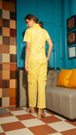 Load image into Gallery viewer, Short Sleeve Tapered Jumpsuit — Yellow Floral

